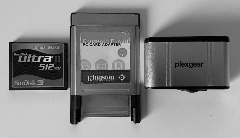 Peripherals for transferring files from a PC to the Amiga: a CF card, a PCMCIA adapter and a USB CF card reader.
