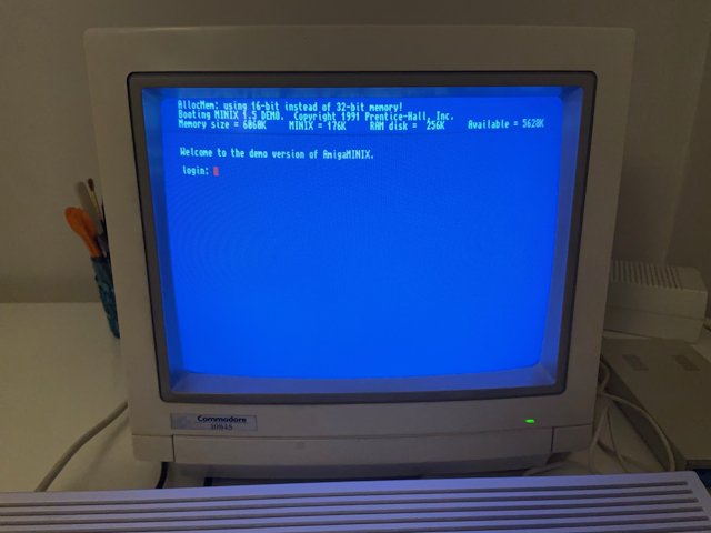 Closeup photo of CRT monitor displaying the Minix Welcome Screen